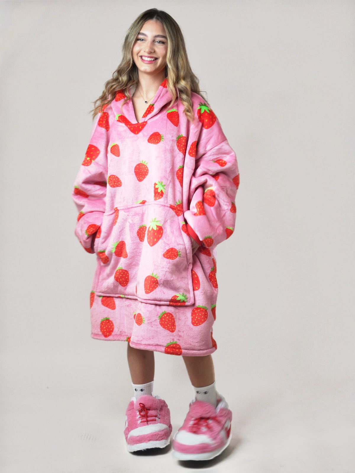 Cozy Strawberry hoodie blanket in strawberry pink, Lifestyle View - Cozify Lebanon